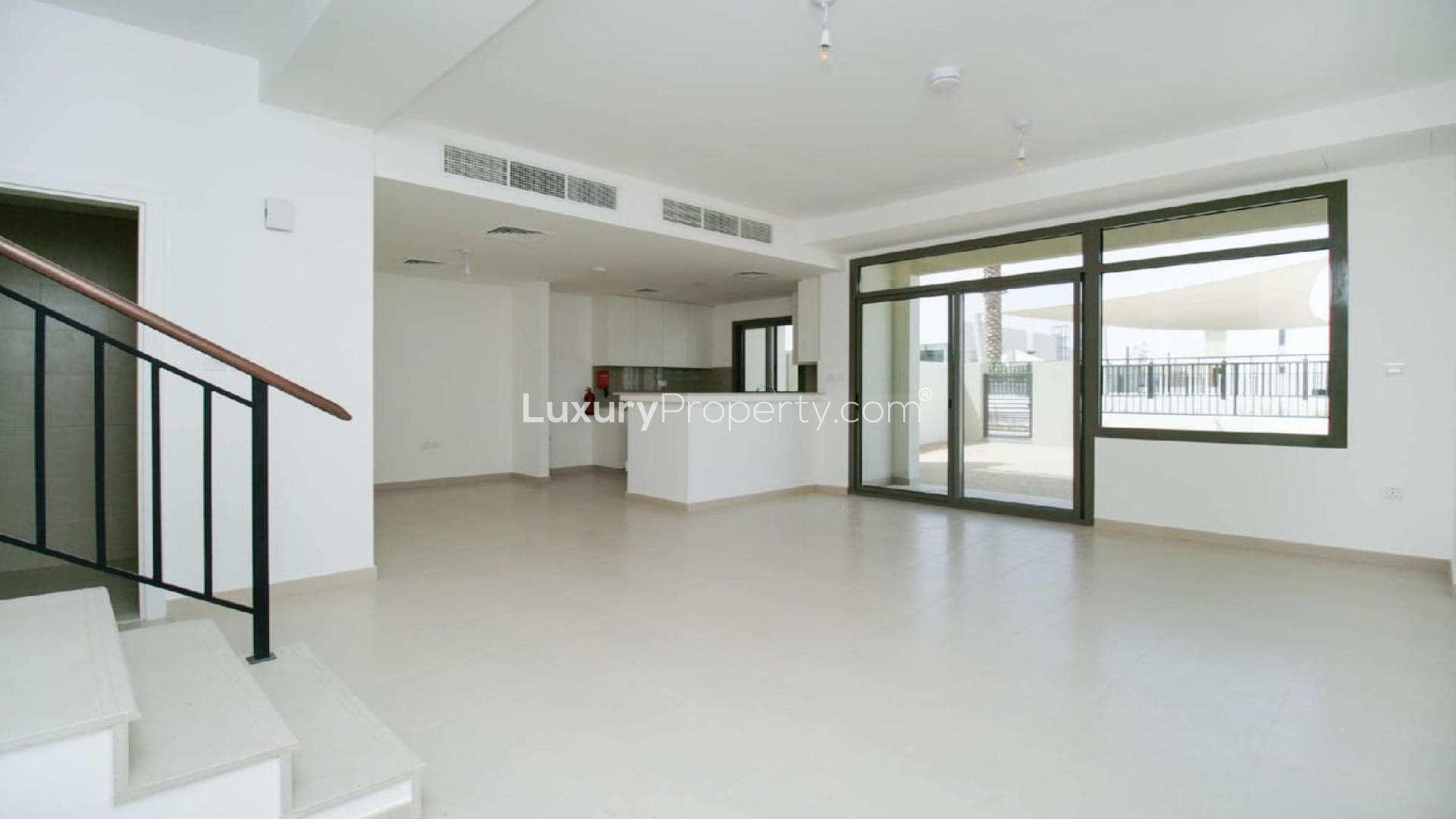 Open-plan living area in three-bedroom townhouse, Noor Townhouses, Town Square, for rent