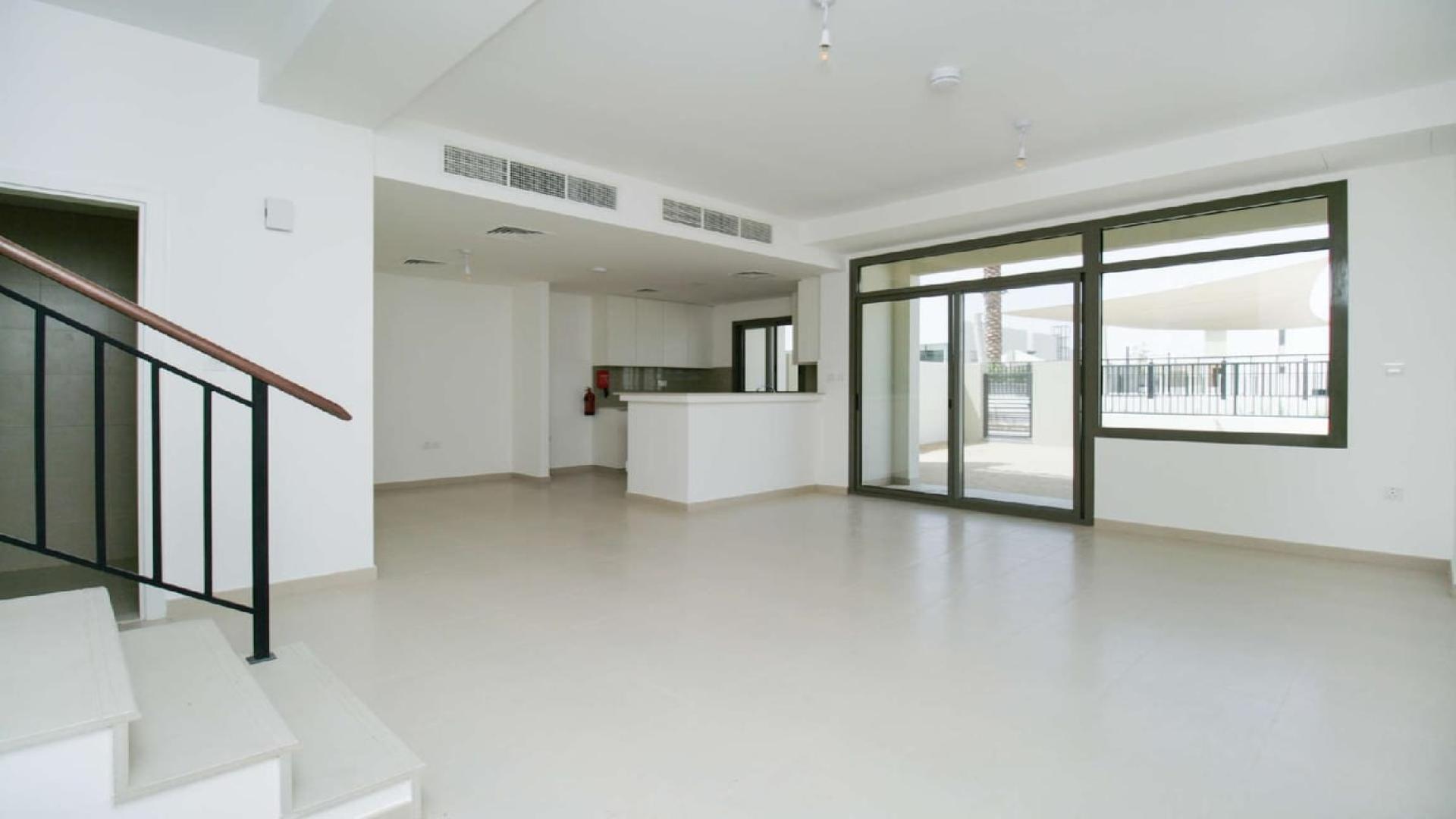 Open-plan living area in three-bedroom townhouse, Noor Townhouses, Town Square, for rent