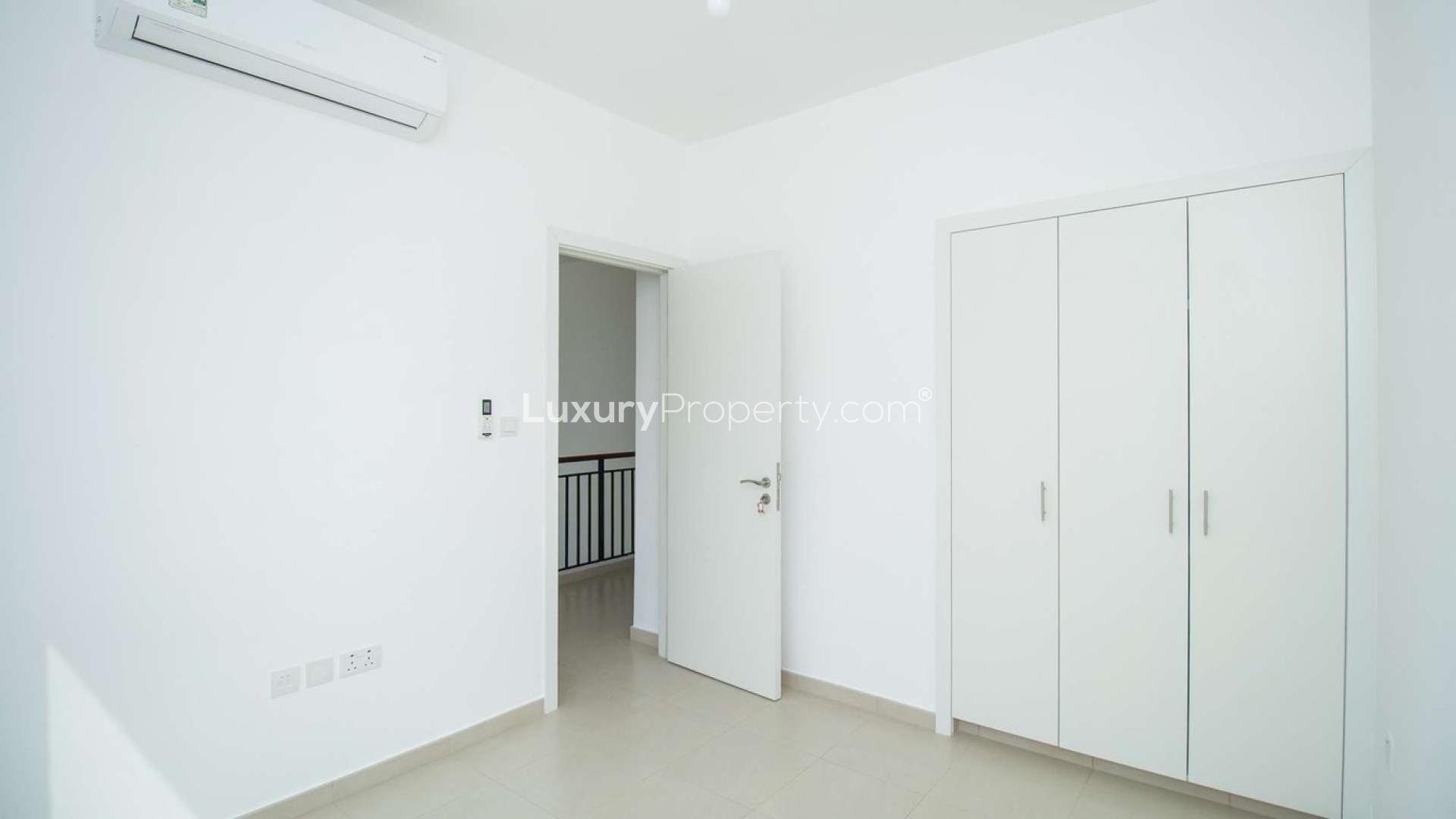 Modern kitchen and living area in 3-bedroom townhouse, Hayat Townhouses, Town Square Dubai