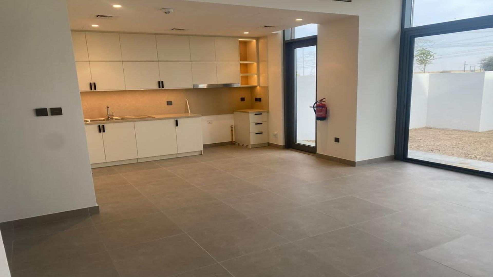 Outdoor pool area in Arabian Ranches 3 townhouse community, Ruba, available for rent