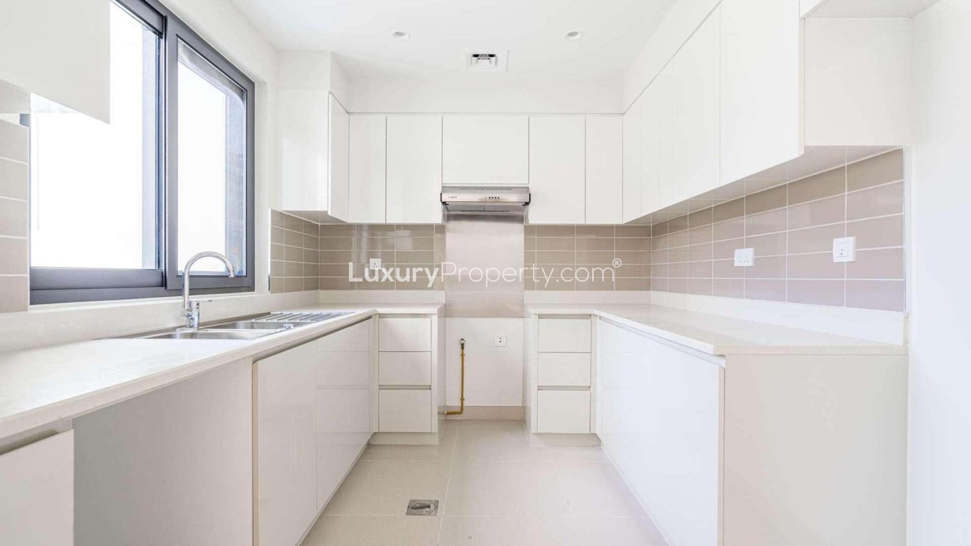 Maple Townhouse exterior with landscaped garden at Dubai Hills Estate for rent