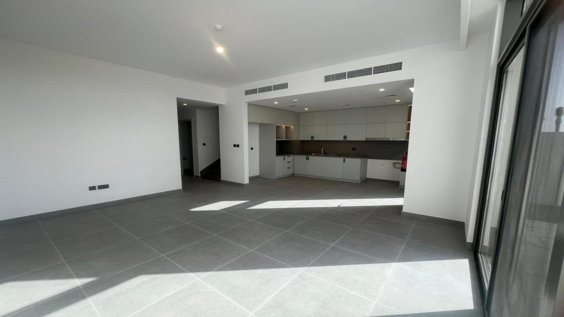 Modern townhouse exterior in Arabian Ranches III, Ruba community, available for rent