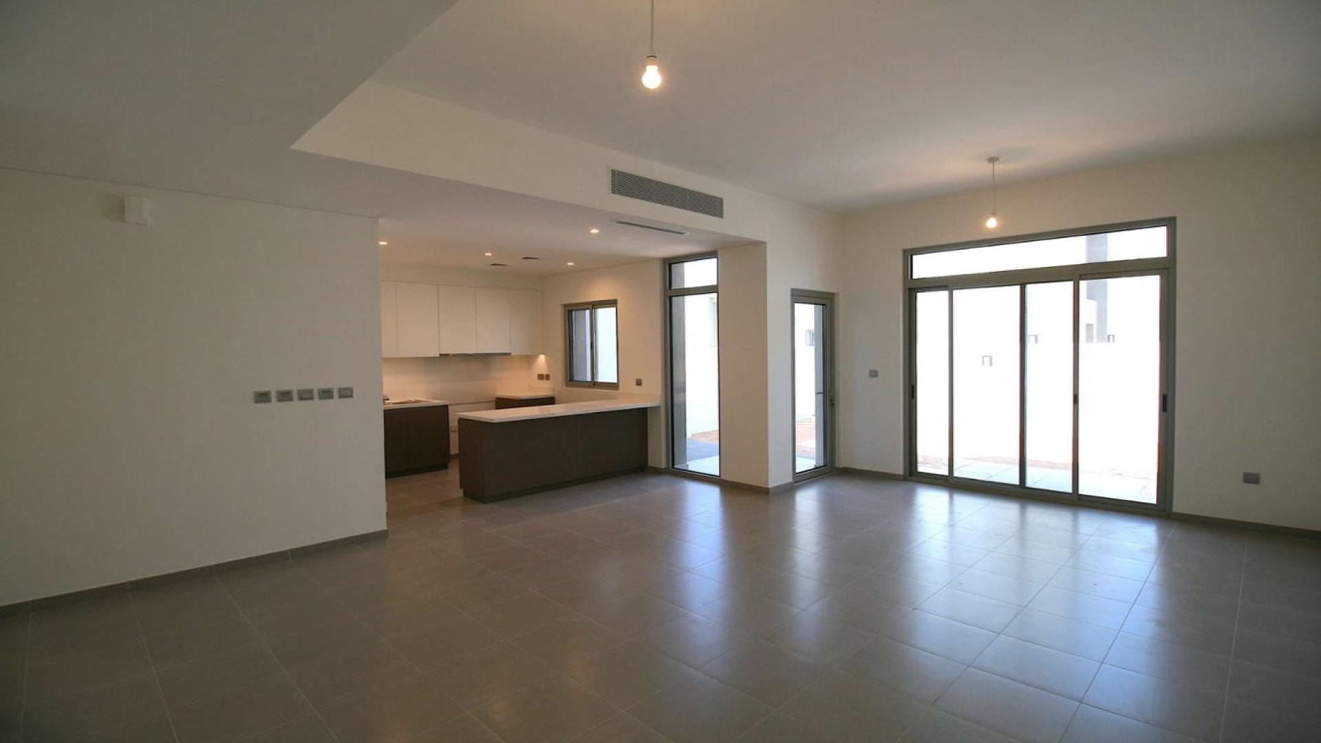 Modern open-plan living area in Arabian Ranches 2, Reem Community townhouse for rent