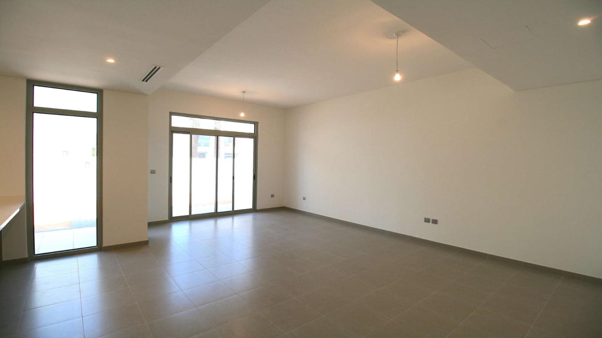 Modern townhouse exterior in Reem Community, Arabian Ranches 2, available for rent