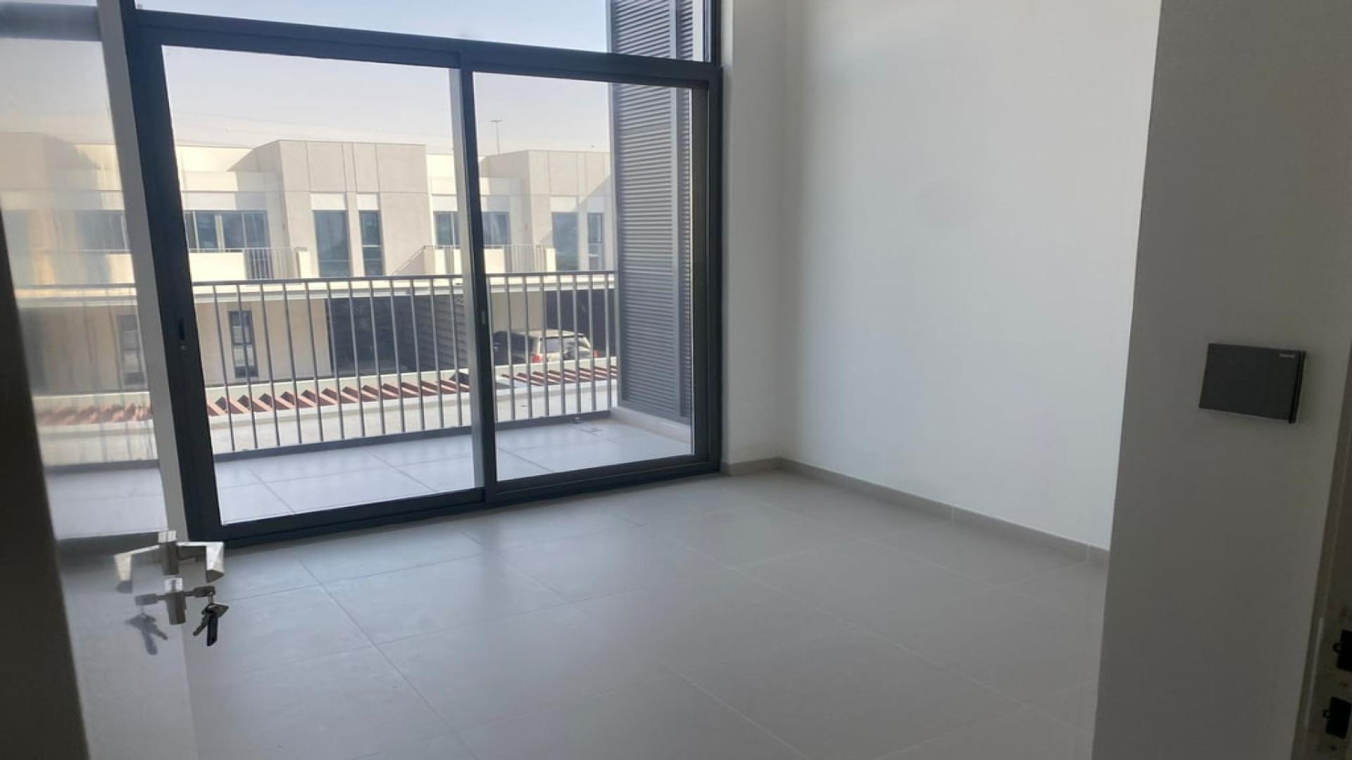 Modern hallway in Arabian Ranches 3 townhouse, Joy sub-community, available for rent