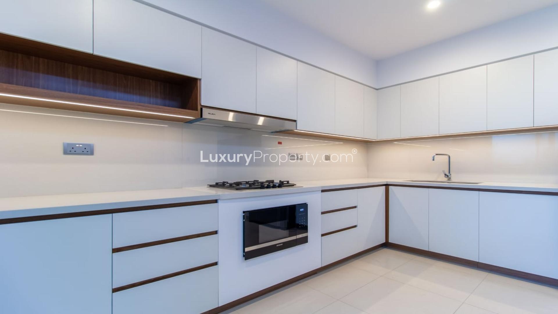 Stylish living room in Camelia townhouse, Arabian Ranches 2, with modern furniture and garden view