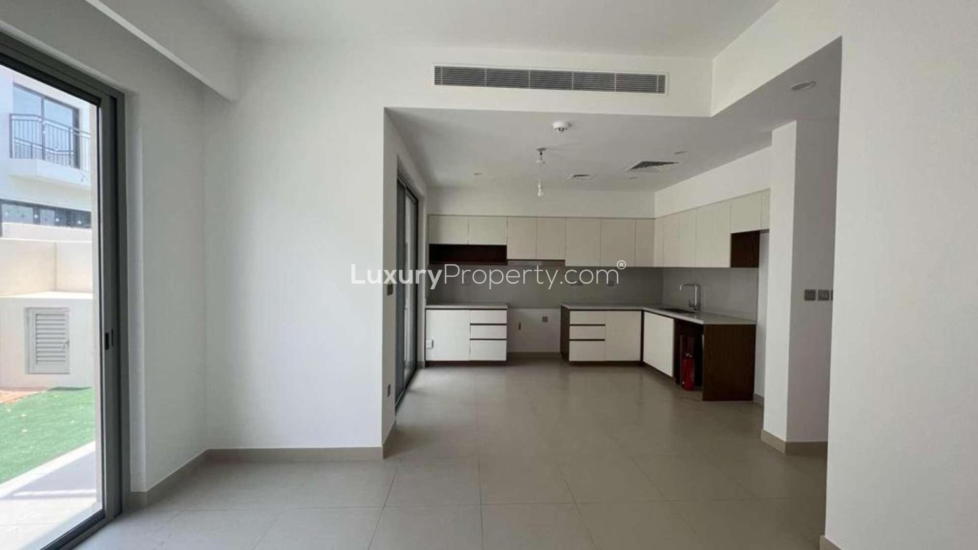 "Modern kitchen in vacant 3-bedroom townhouse, Camelia, Arabian Ranches 2, overlooking pool area.","Spacious modern kitchen in 3-bedroom Camelia townhouse, Arabian Ranches 2, available for rent.",Empty bedroom with built-in wardrobe in Camelia townhouse, Arabian Ranches 2, for rent