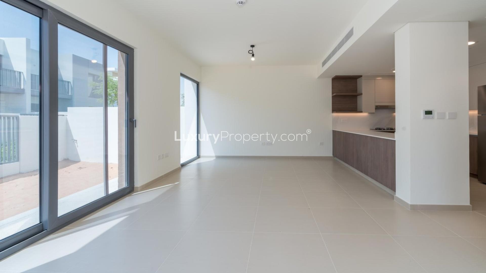 Modern kitchen and living area in Tilal Al Ghaf townhouse for rent, Elan community