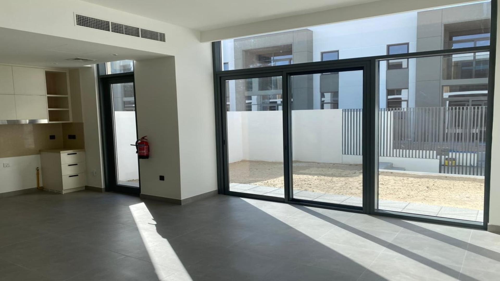 Townhouse exterior view in Ruba, Arabian Ranches 3, residential community street scene