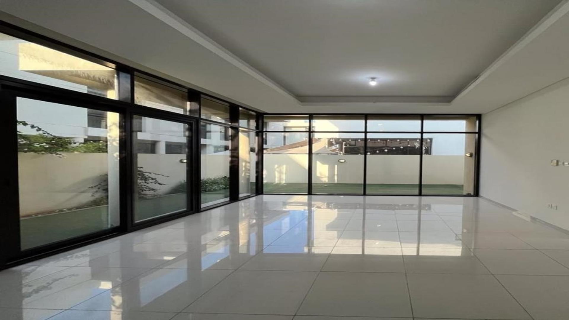 Luxurious townhouse in Damac Hills with spacious living area and large windows for rent