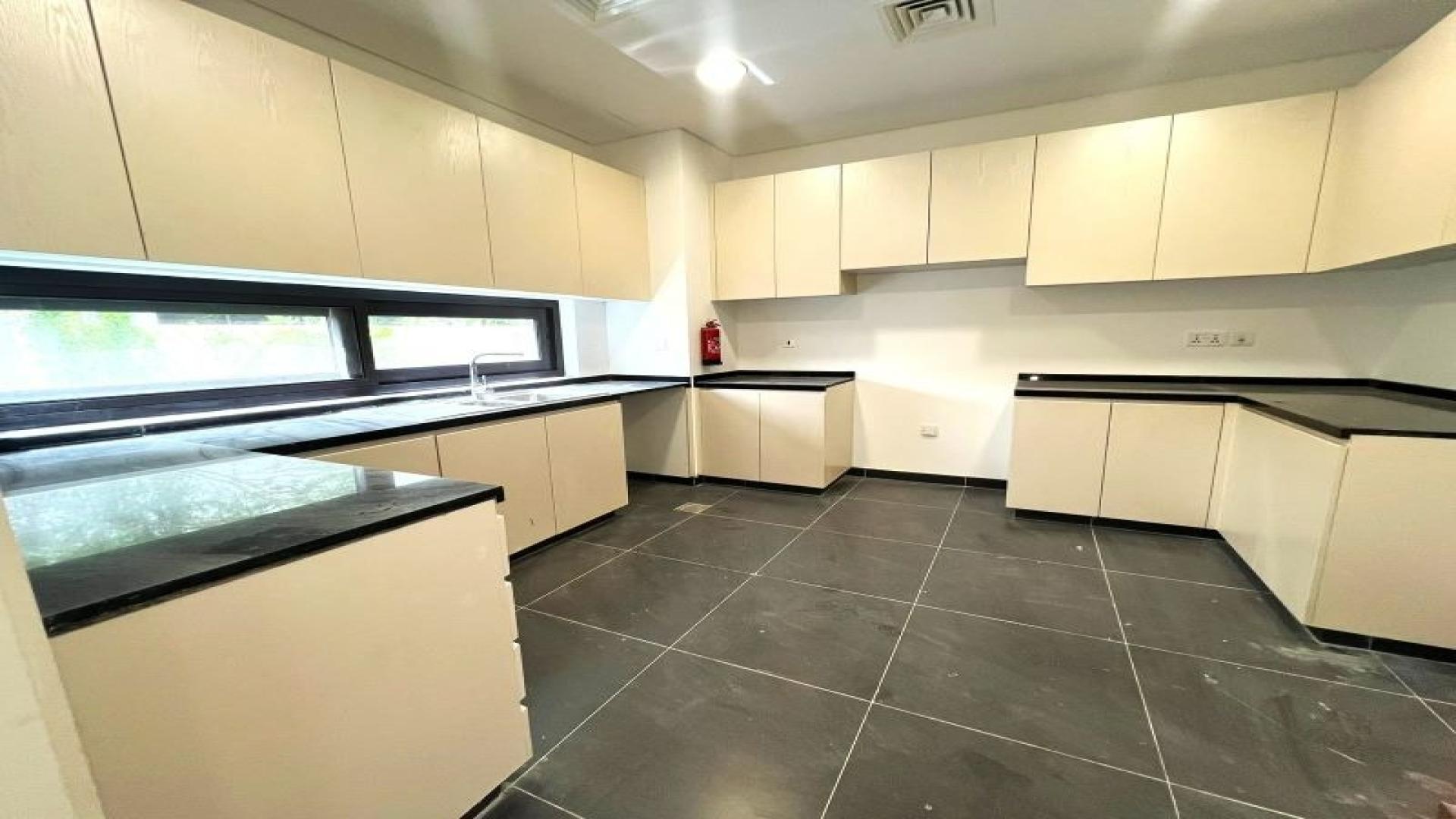 Modern kitchen in a 3-bedroom townhouse, Damac Hills, available for rent