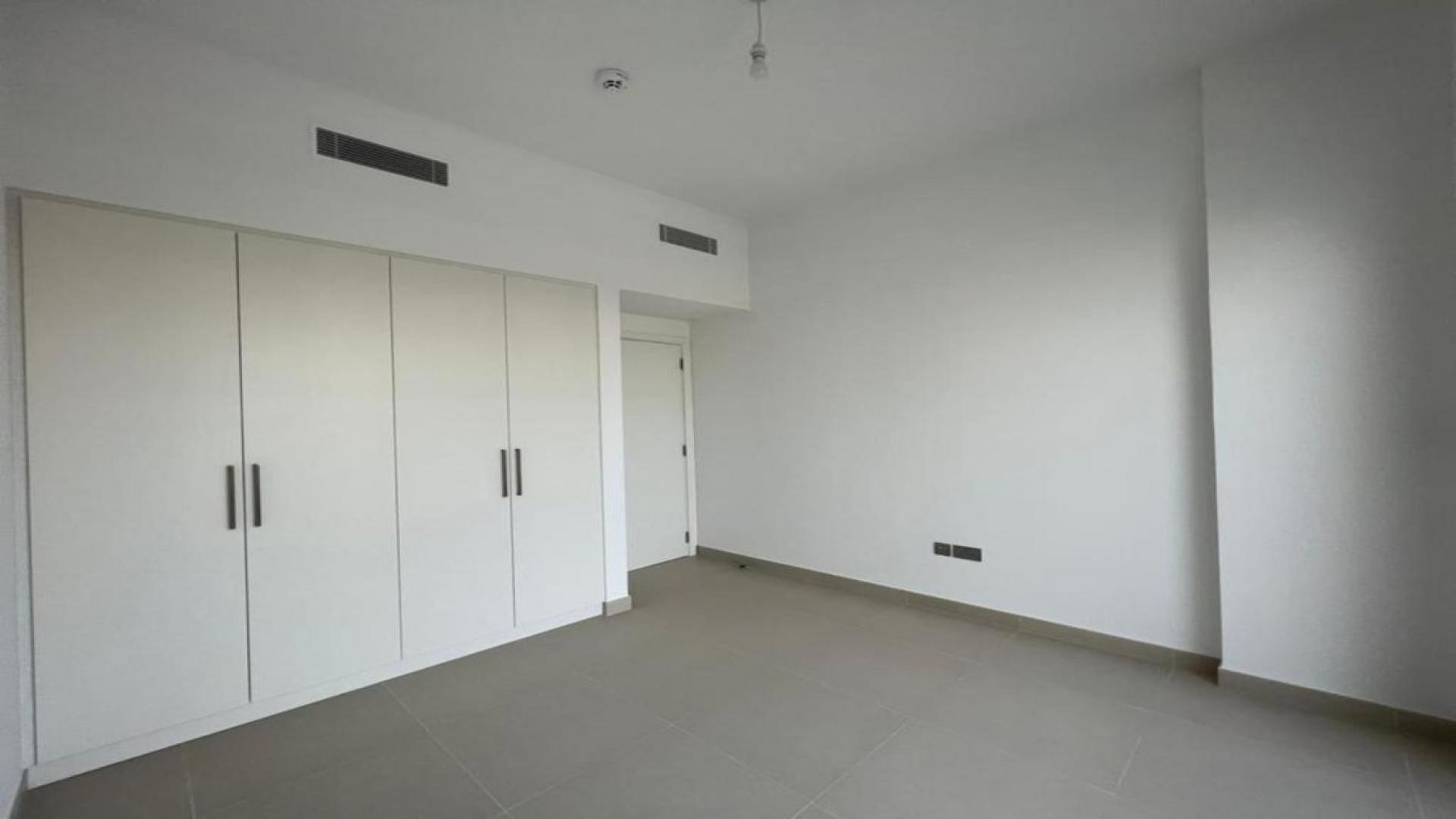 Modern kitchen and dining area in Camelia townhouse, Arabian Ranches 2, available for rent