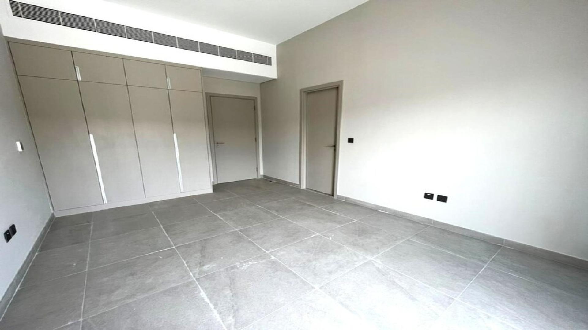 Modern kitchen and living area in District 7 townhouse, Mohammed Bin Rashid City