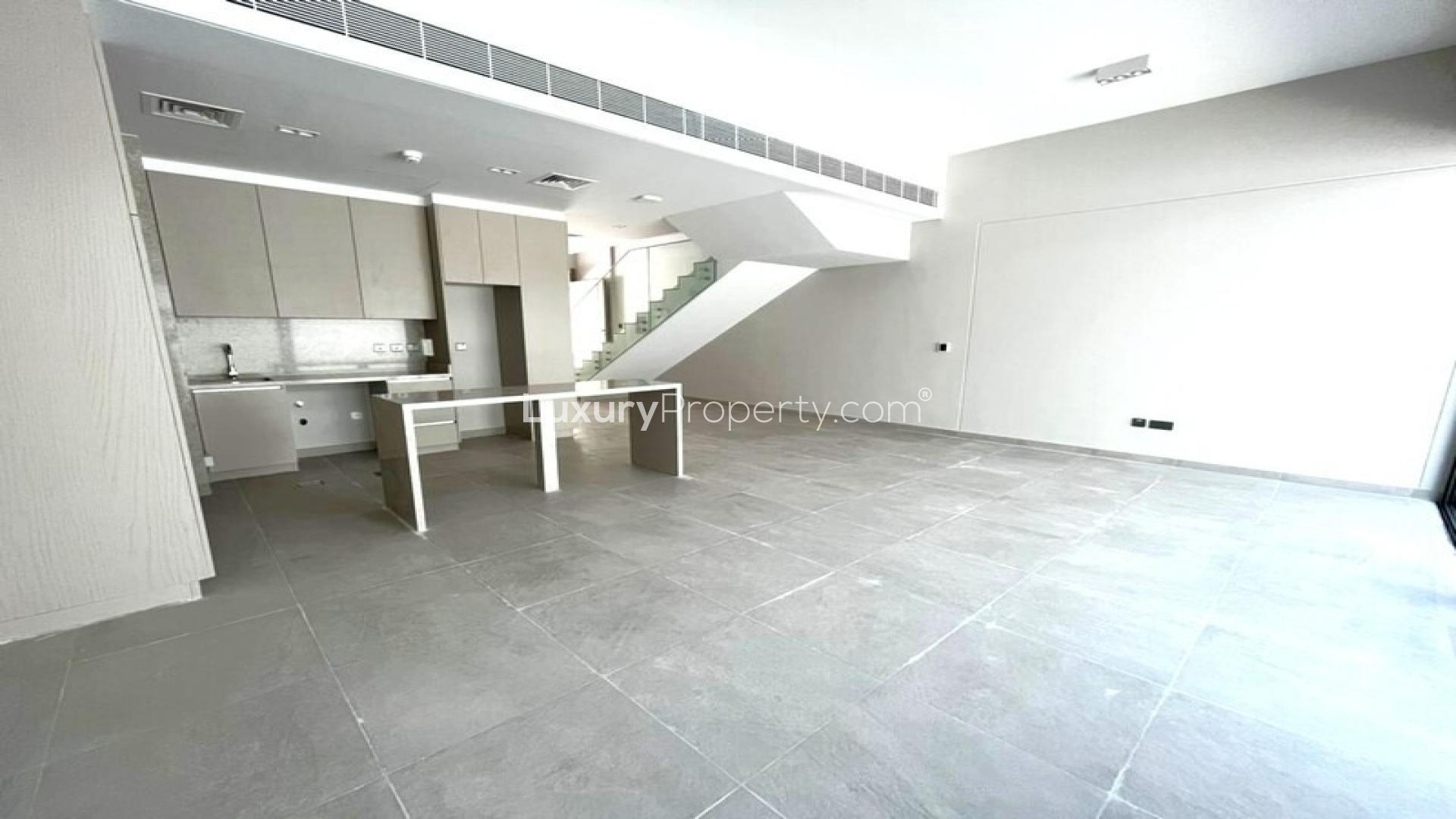 Modern kitchen and living area in District 7 townhouse, Mohammed Bin Rashid City, for rent