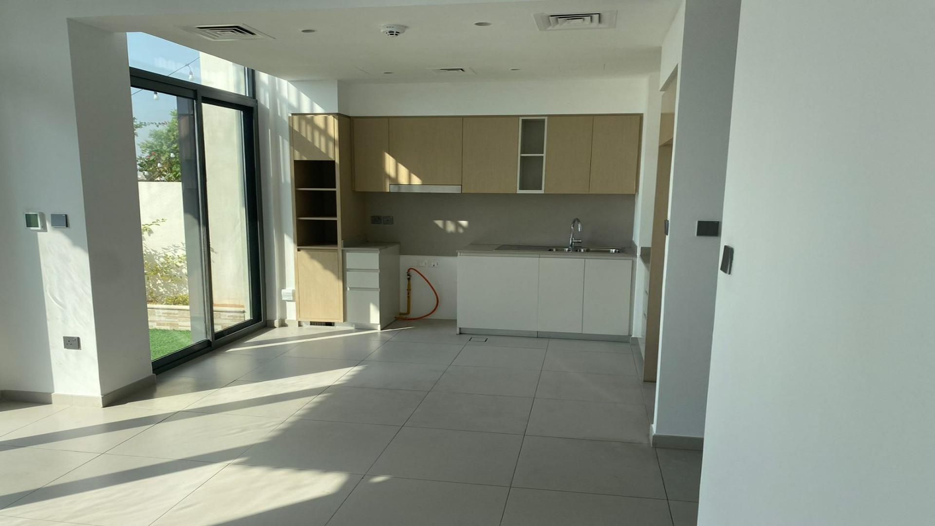 Vacant townhouse interior with garden view, Arabian Ranches 3, Sun community, available for rent