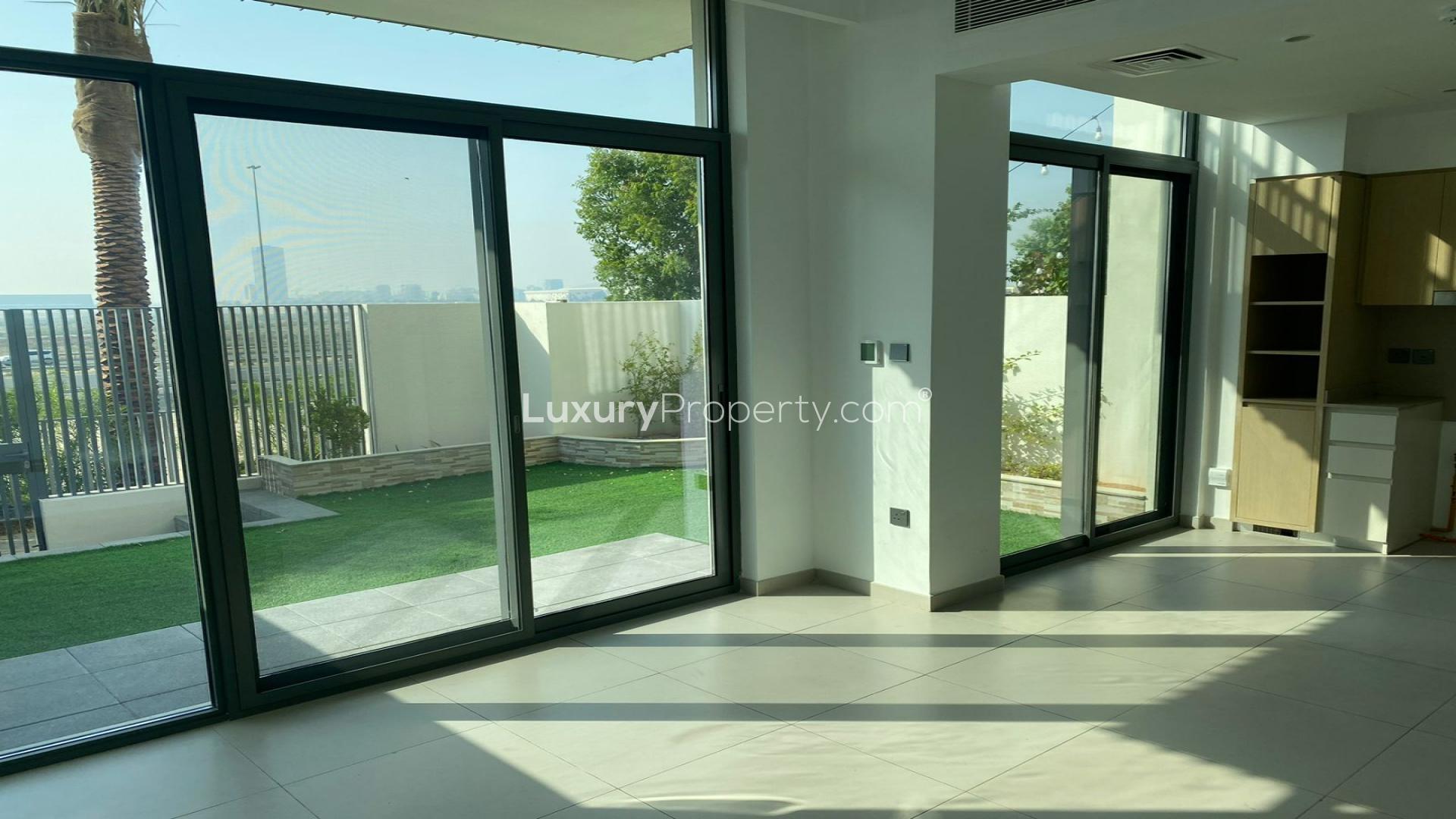 Exterior view of vacant townhouse in Sun, Arabian Ranches 3, featuring modern design