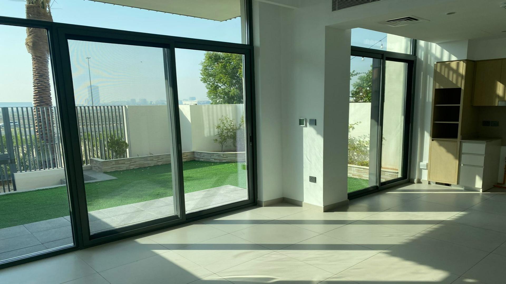 Exterior view of vacant townhouse in Sun, Arabian Ranches 3, featuring modern design