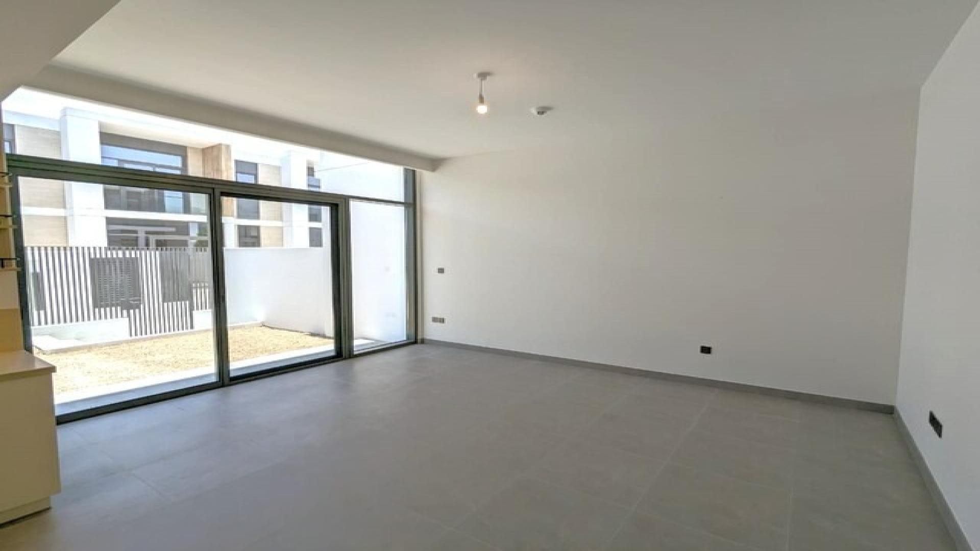 Modern kitchen in Ruba townhouse, Arabian Ranches 3, with sleek cabinetry and ample space