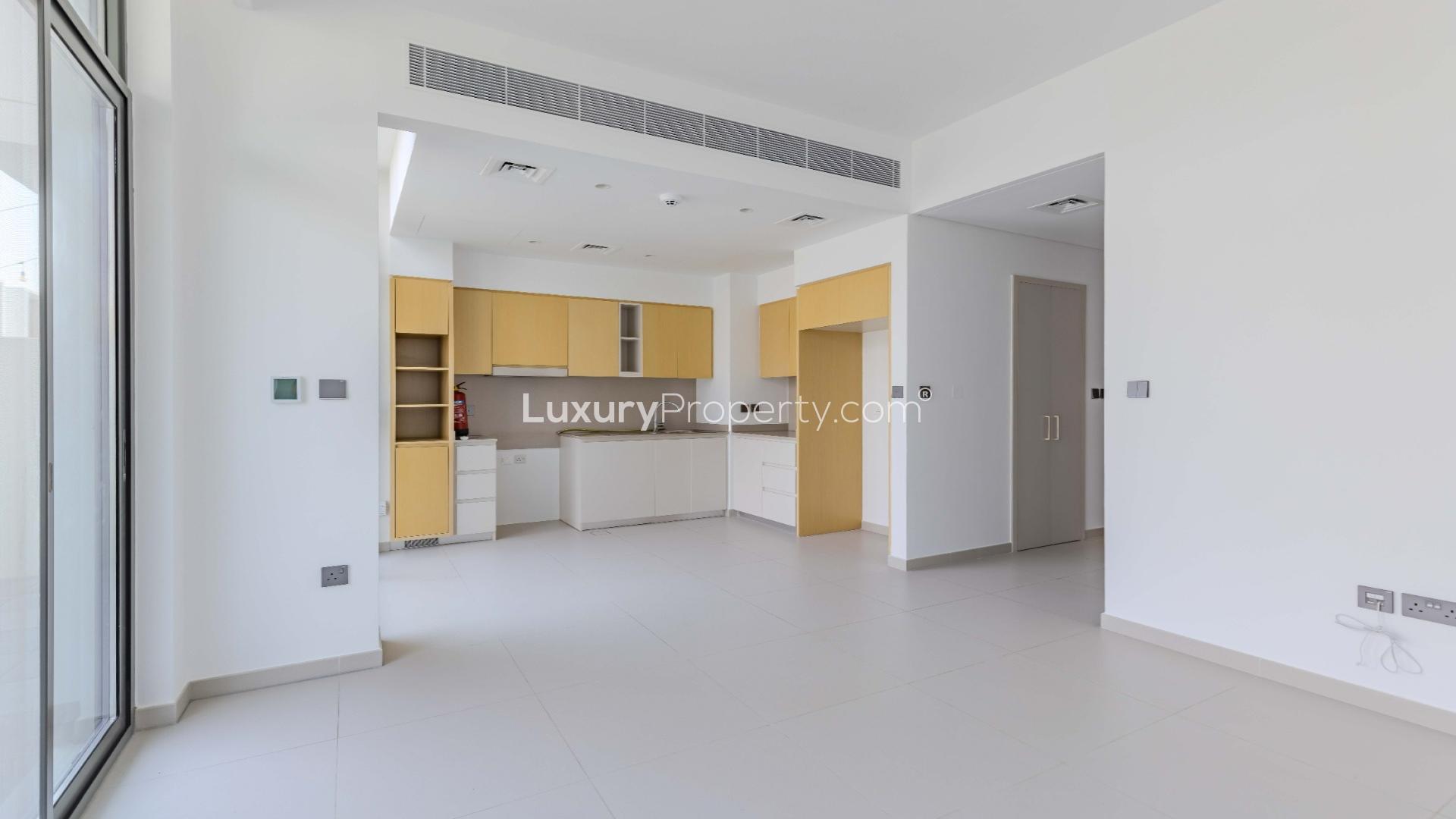 Modern kitchen and living area in Arabian Ranches 3 townhouse, Spring community