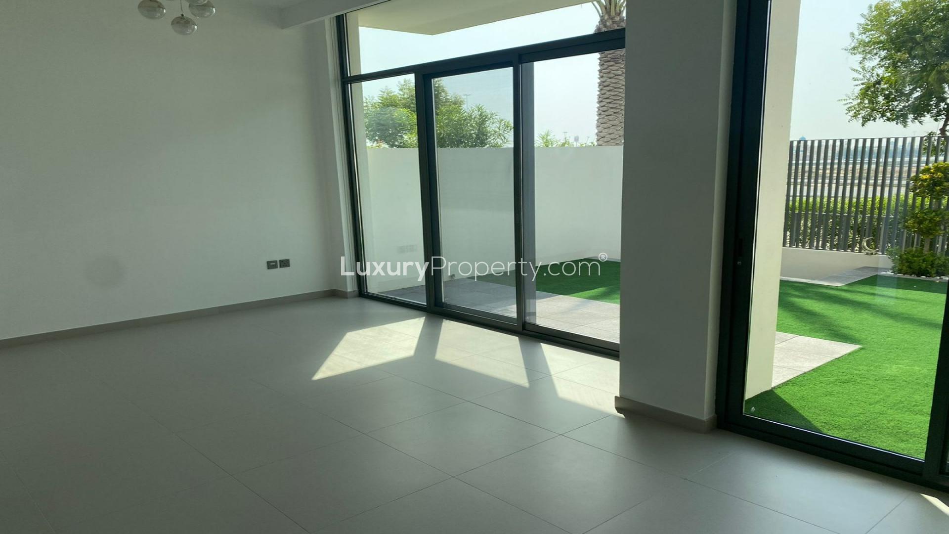 Charming 3-bedroom townhouse exterior in Arabian Ranches 3, Sun community, with private garden