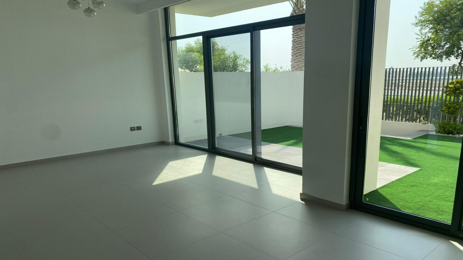 Charming 3-bedroom townhouse exterior in Arabian Ranches 3, Sun community, with private garden