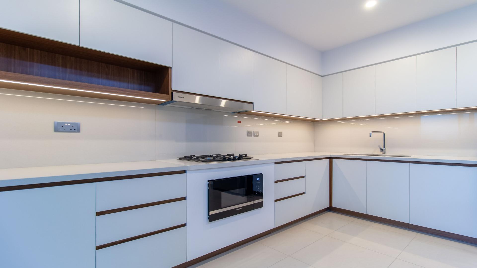 Modern living room in Camelia townhouse, Arabian Ranches 2, featuring stylish furniture and garden view