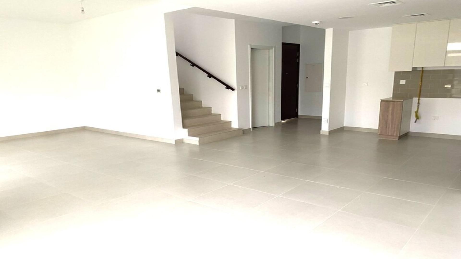 Spacious living area with staircase in 3-bedroom townhouse, Reem Townhouses, Town Square