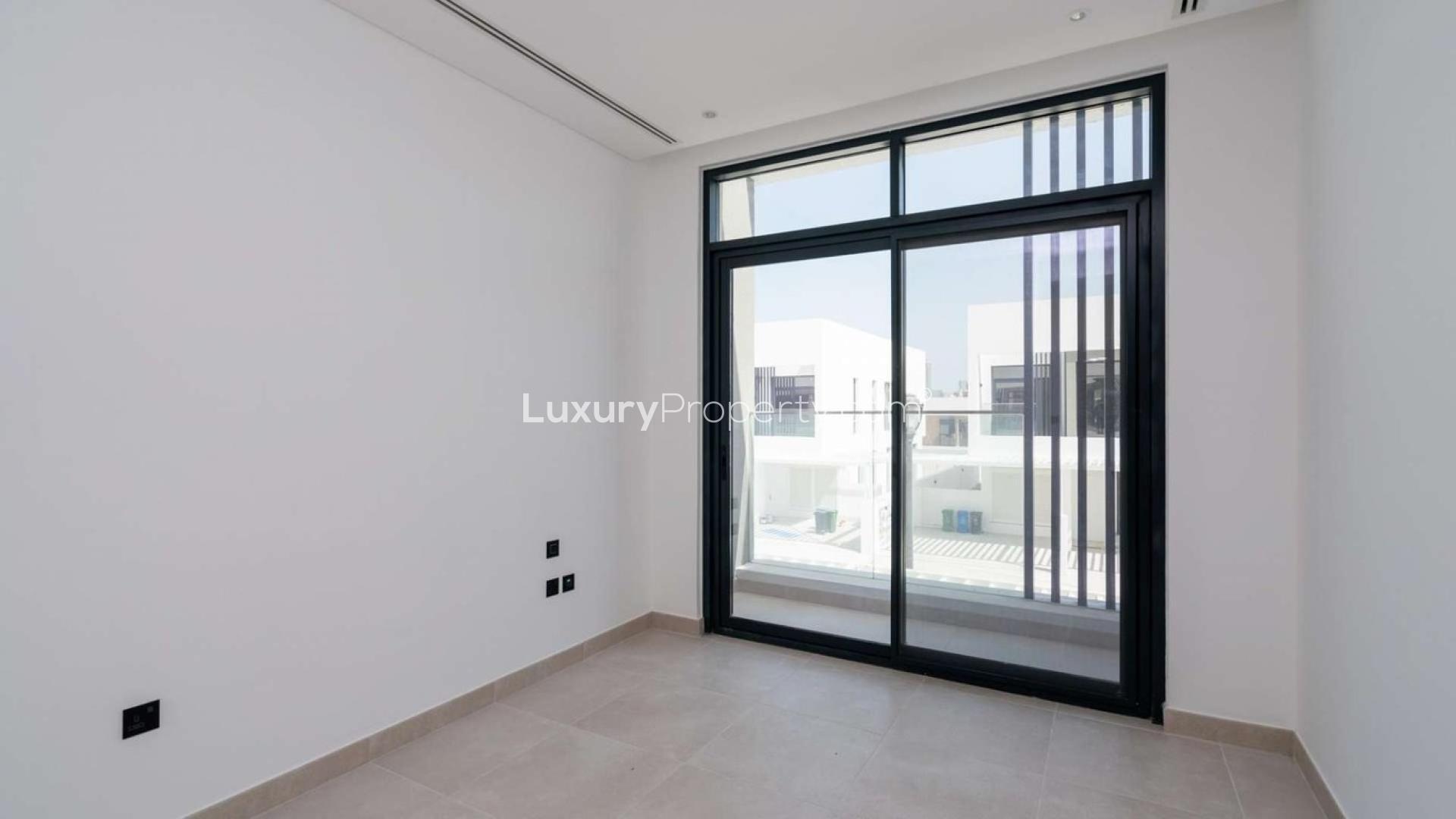 Modern townhouse interior with large windows in Jumeirah Golf Estates, for sale