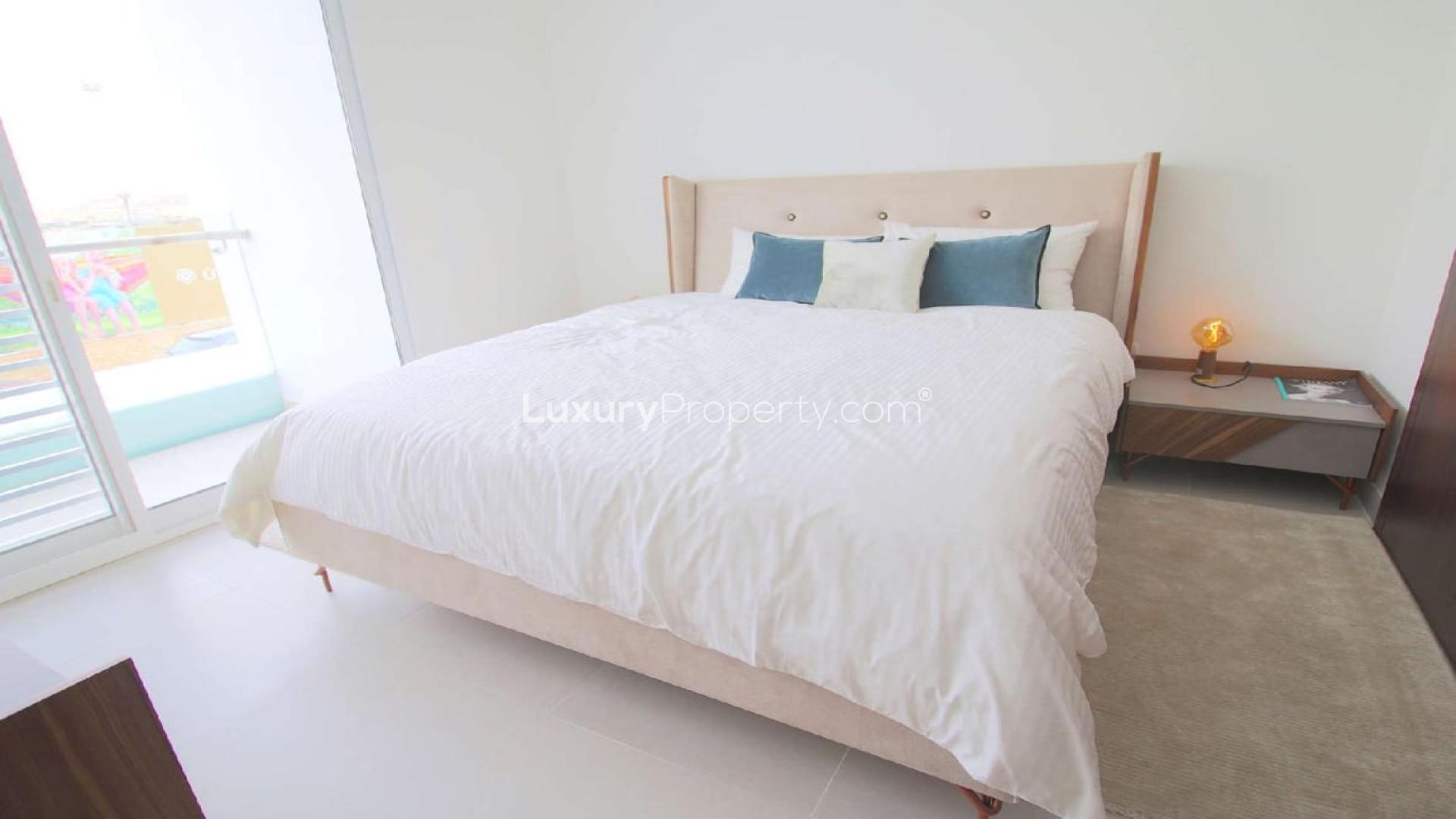 Modern living room in 3-bed duplex villa, Arabella Townhouses, Mudon. Bright, spacious interior design