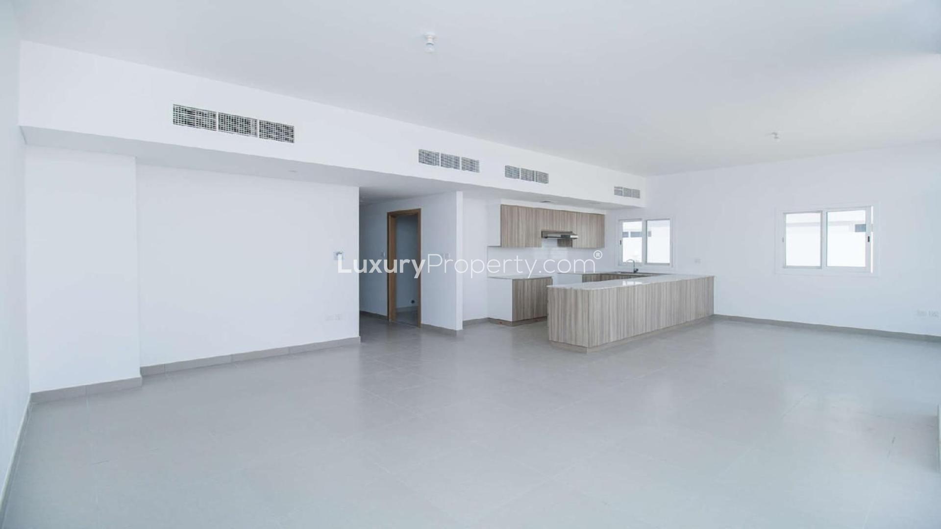 Spacious open-plan kitchen and living area in Arabella Townhouse, Mudon for sale