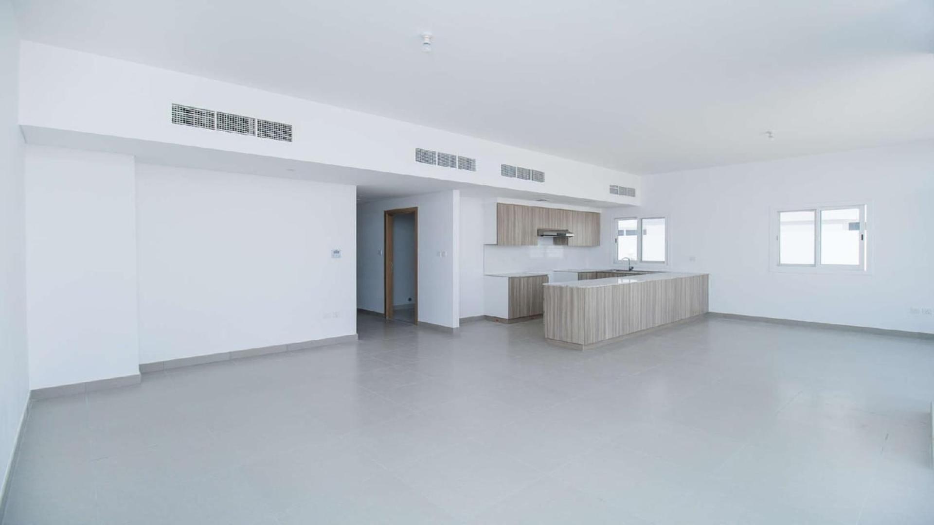 Spacious open-plan kitchen and living area in Arabella Townhouse, Mudon for sale