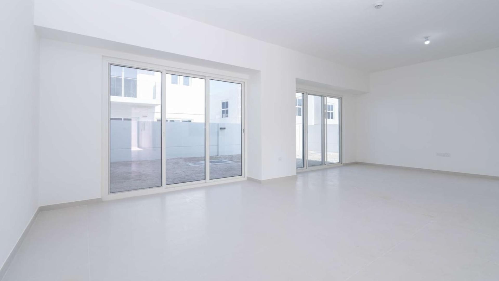 Spacious living room in Arabella 3 villa, Mudon with large windows and natural light