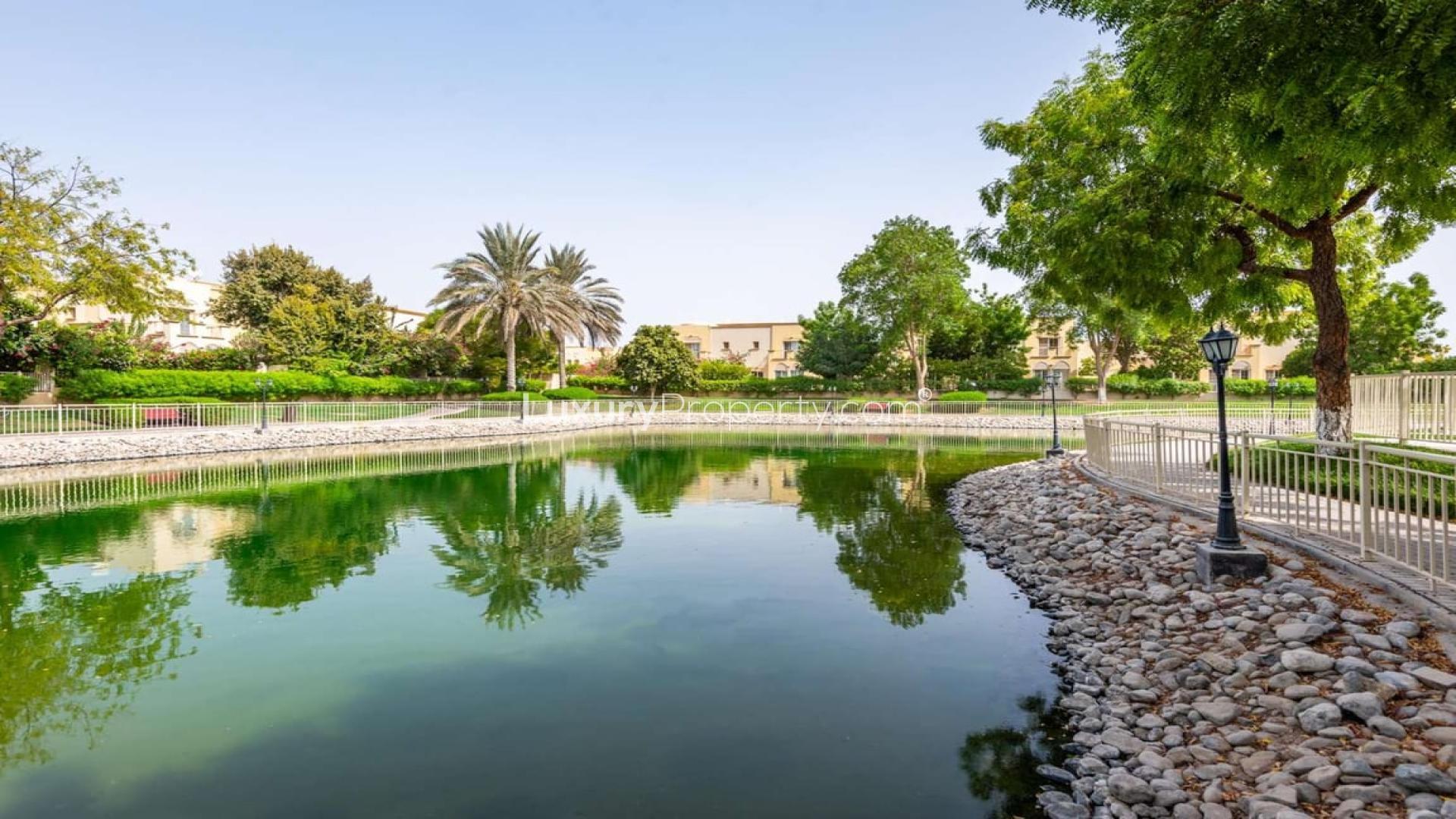 Vastu compliant townhouse in The Springs, overlooking serene pool and lush park scenery