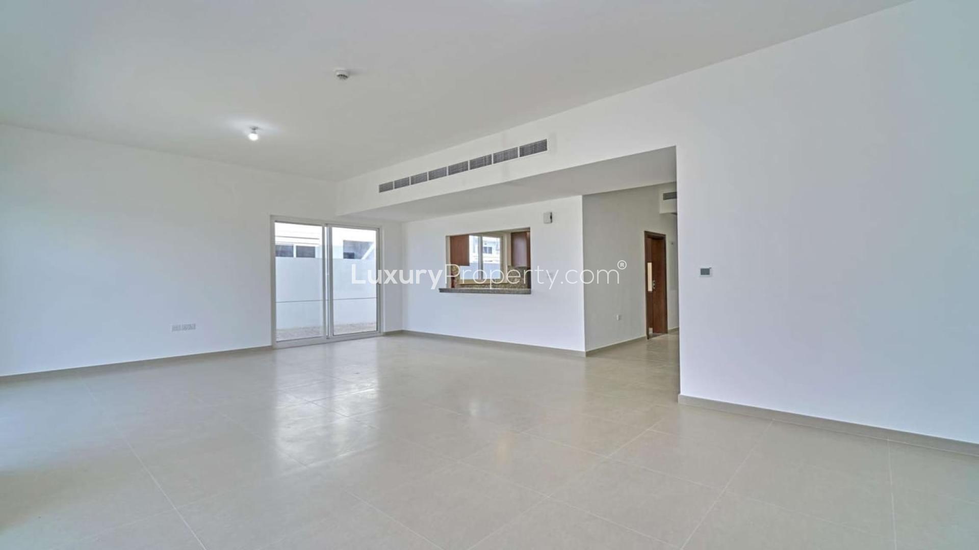 Exterior view of modern 3-bedroom townhouse for sale in Arabella, Mudon community