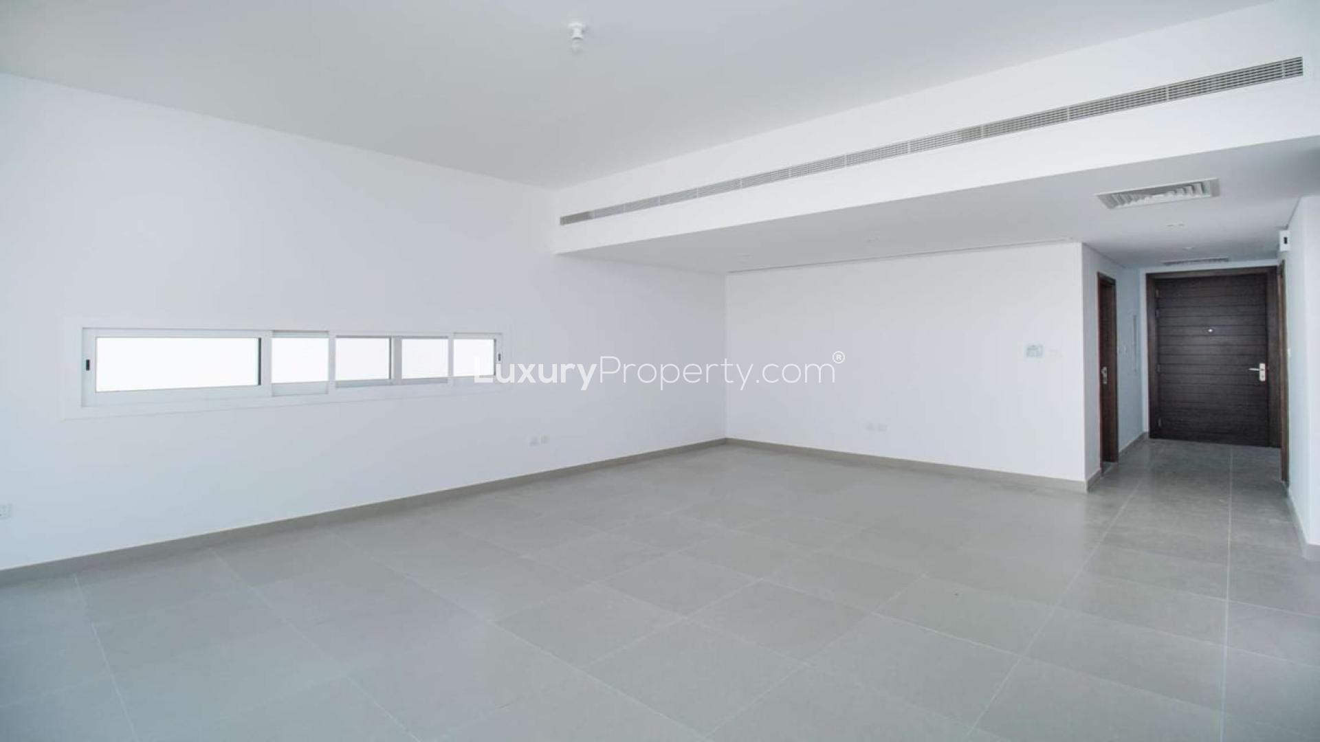 Empty living room in 3-bedroom townhouse for sale, Arabella 2, Mudon