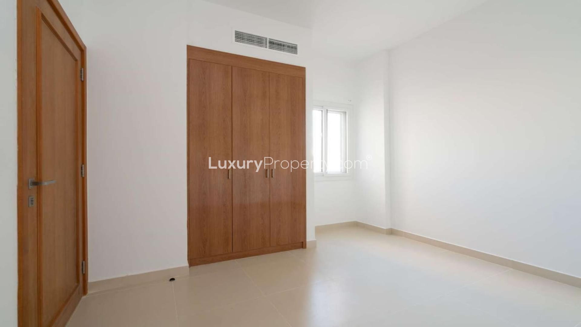 Elegant three-bedroom villa exterior in Casa Viva, Serena, featuring modern architecture and lush greenery