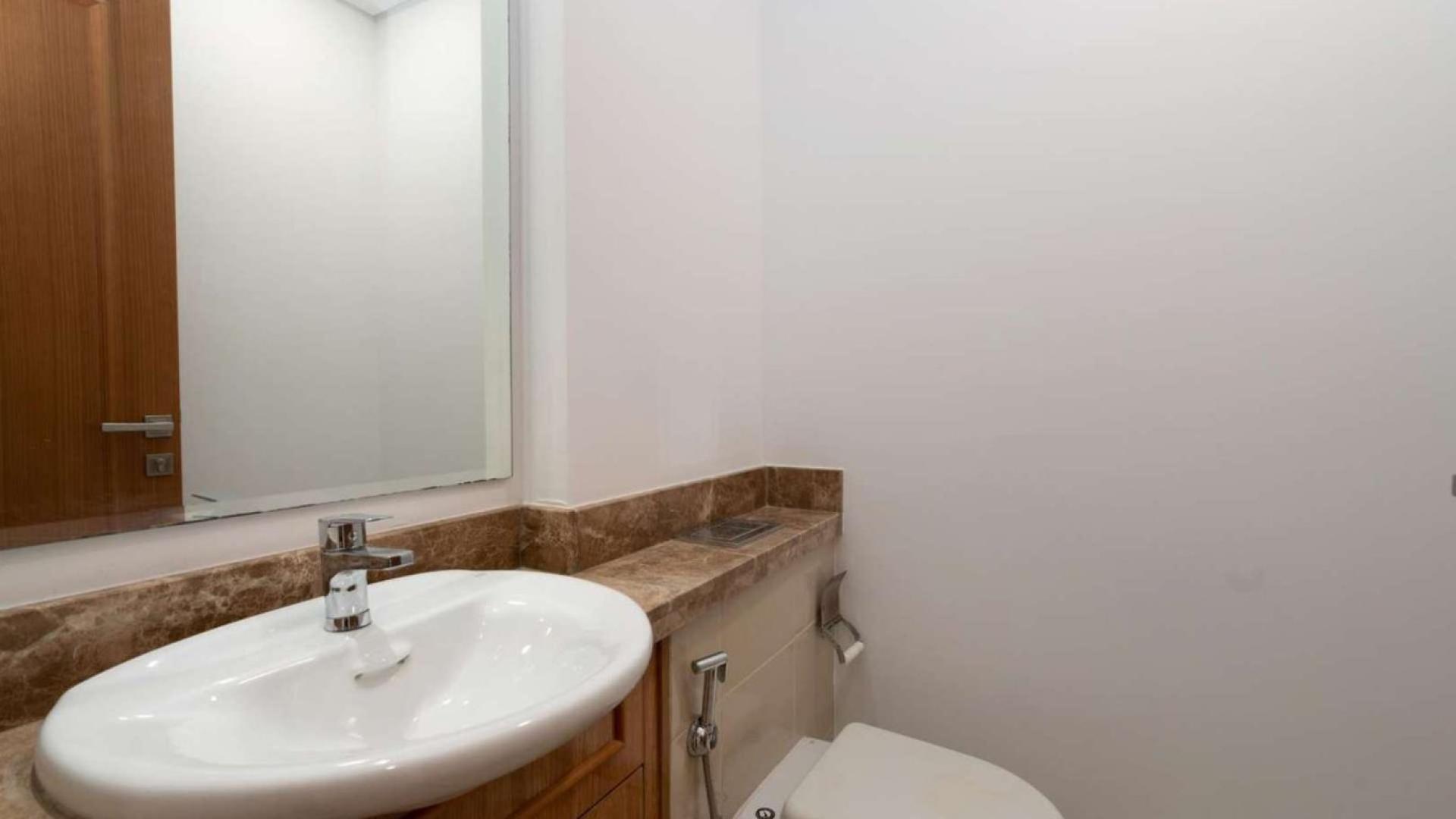 Alt text: "Charming 3-bedroom townhouse exterior in Casa Viva, Serena, Dubailand for sale.",Spacious 3-bedroom townhouse in Casa Viva, Serena, Dubailand, for sale