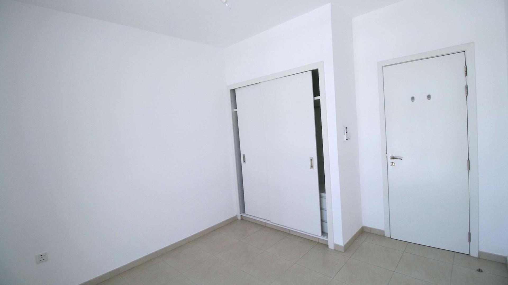 Spacious living area with garden view in Zahra Townhouses, Town Square, Dubai