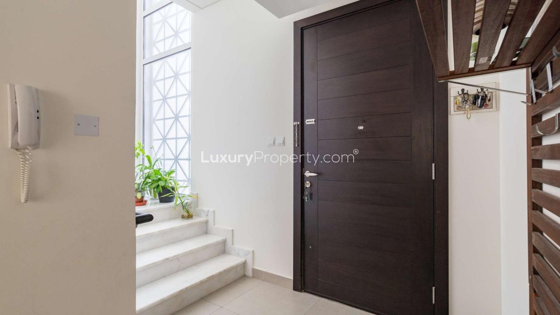 Three-bedroom townhouse bedroom with large window in Arabella 1, Mudon