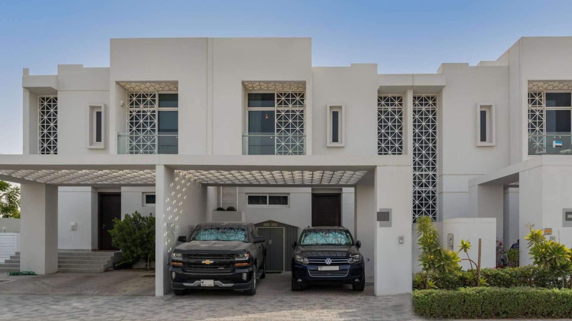 Modern living and dining area in Arabella 1 townhouse, Mudon, with stylish decor