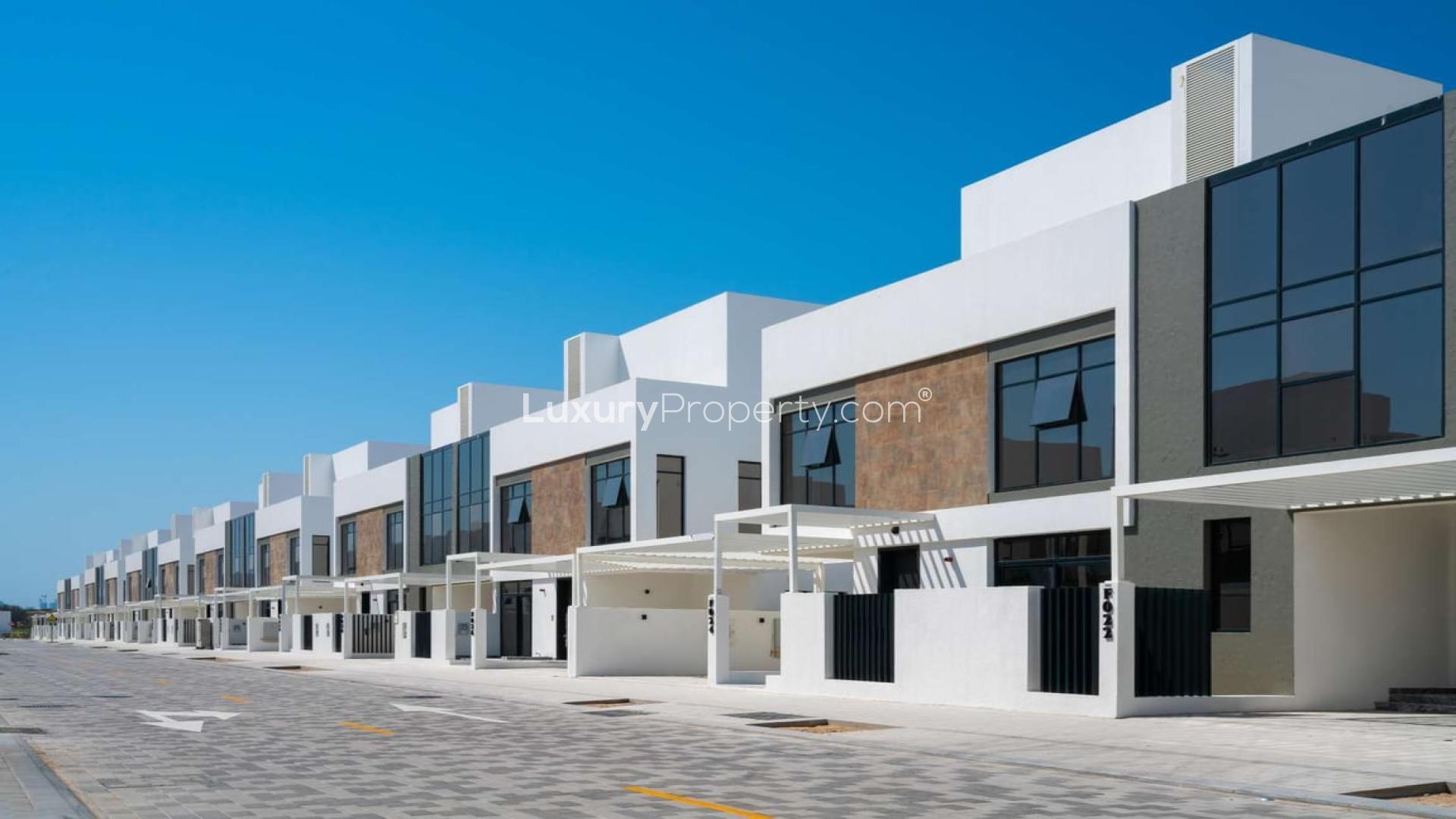 Modern townhouse exterior in Jumeirah Golf Estates, Jumeirah Luxury community, for sale