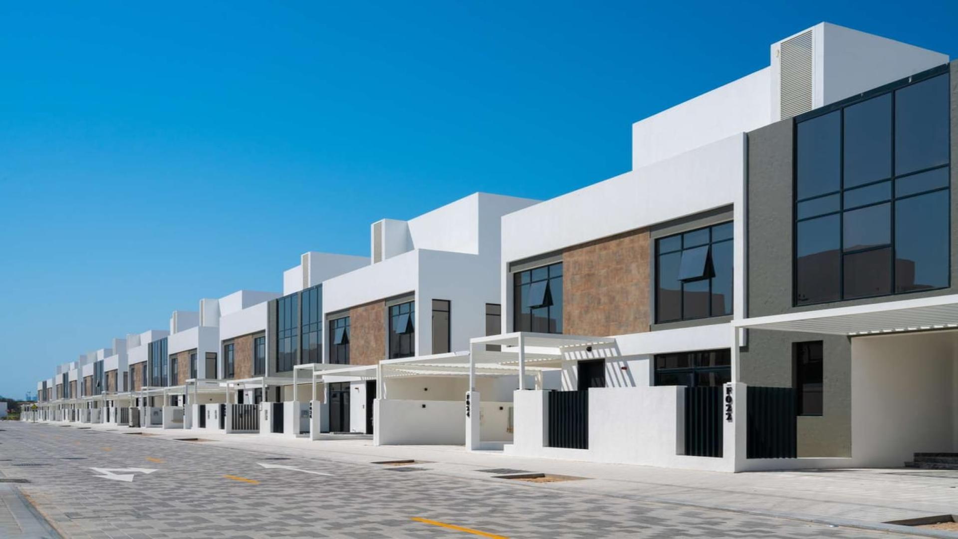 Modern townhouse exterior in Jumeirah Golf Estates, Jumeirah Luxury community, for sale