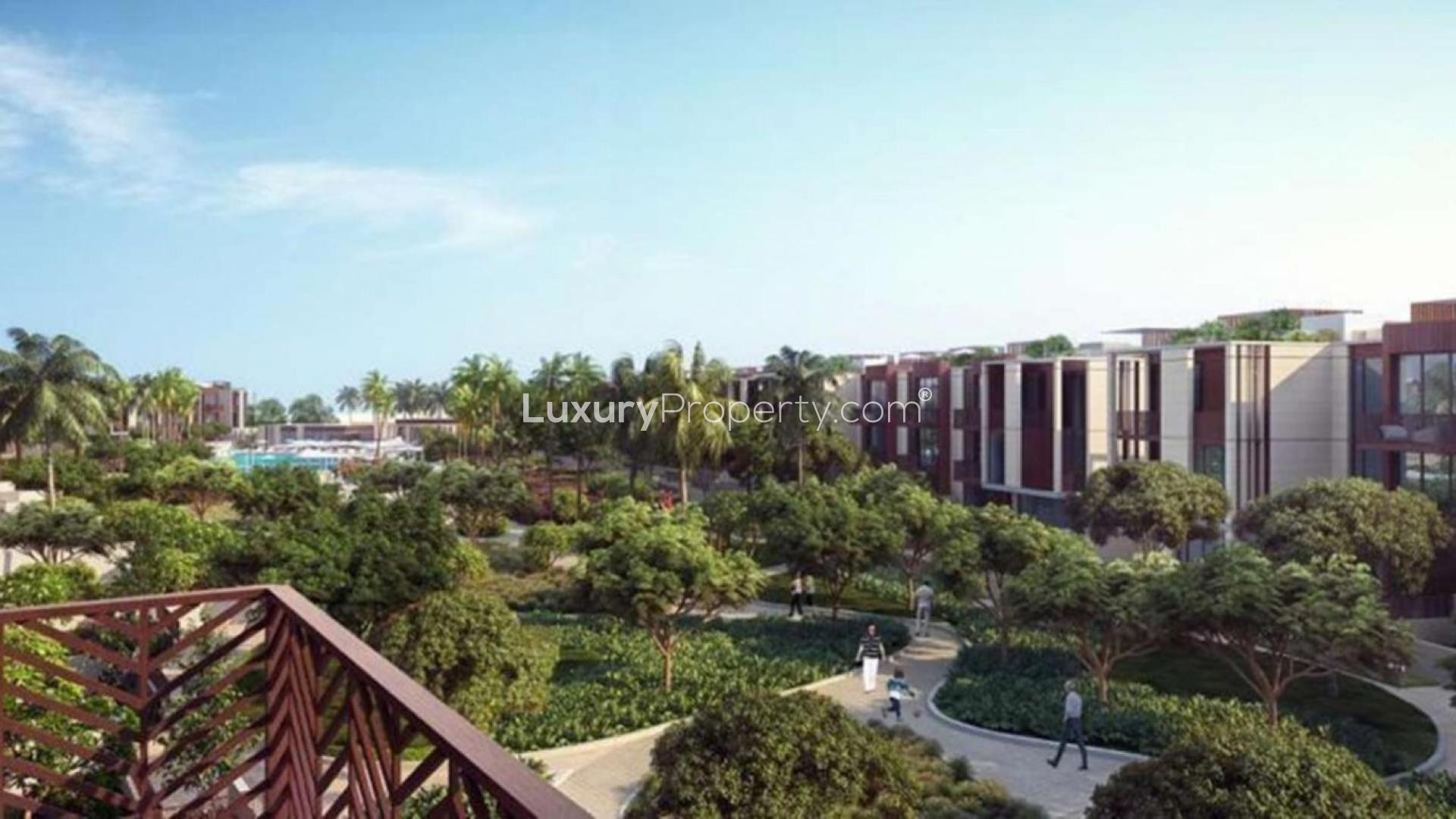 Contemporary townhouse exterior in Jumeirah Bay Island, featuring modern architecture and lush landscaping