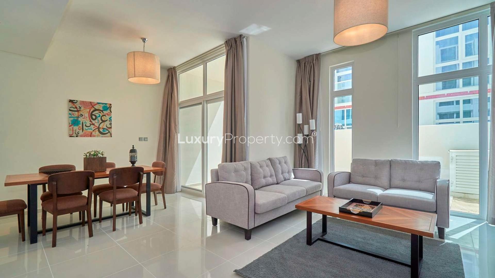 Bright living area in 3-bedroom luxury townhouse, Pacifica, Damac Hills 2, modern furnishings