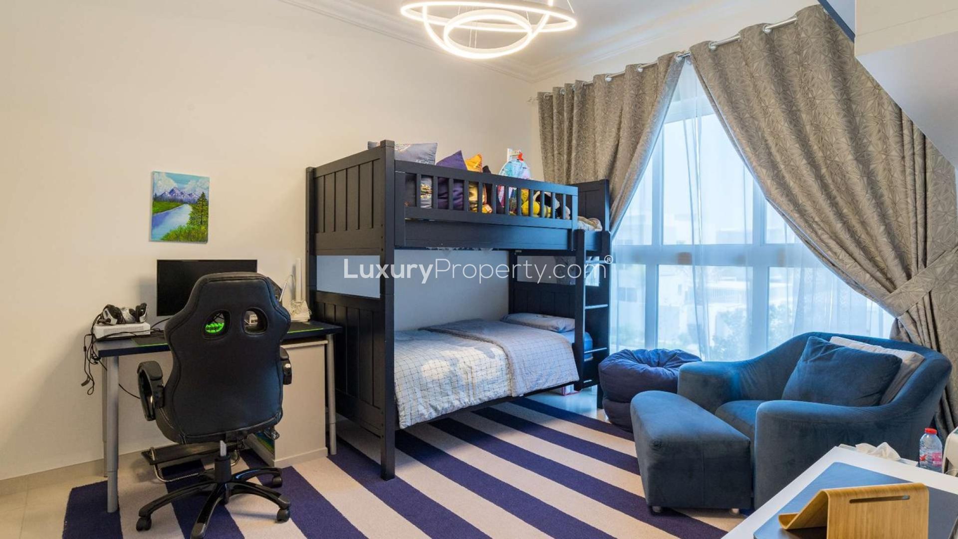 Spacious backyard of 3-bedroom townhouse in Arabella 3, Mudon with landscaped garden