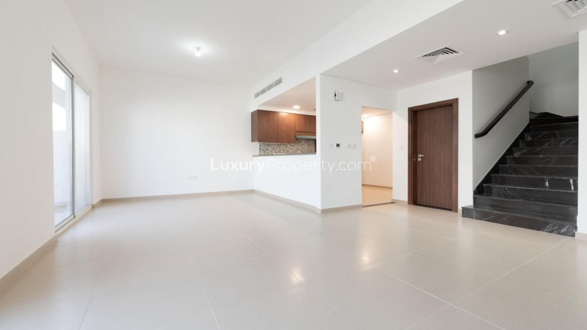 Modern living room in 3-bedroom townhouse, Arabella 3, Mudon with staircase and open kitchen
