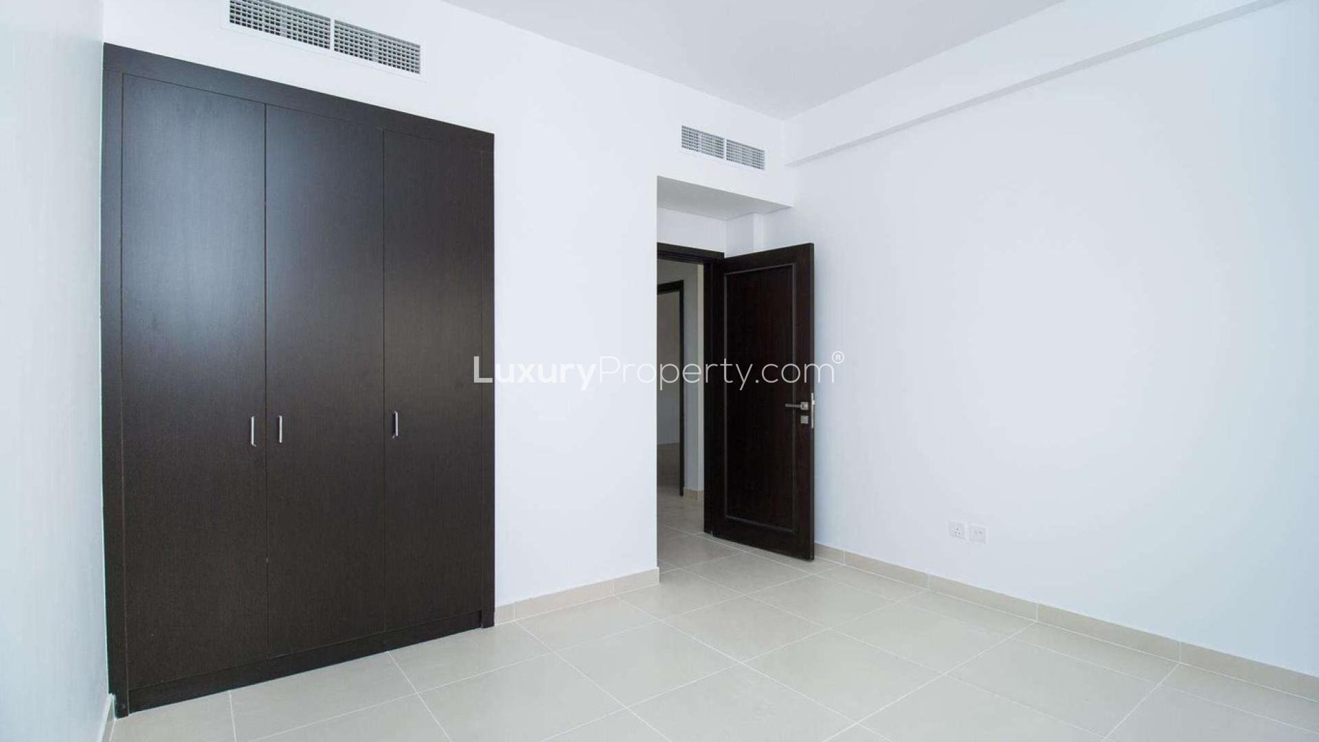 Vacant three-bedroom townhouse exterior in Casa Dora, Serena, with two-car garage