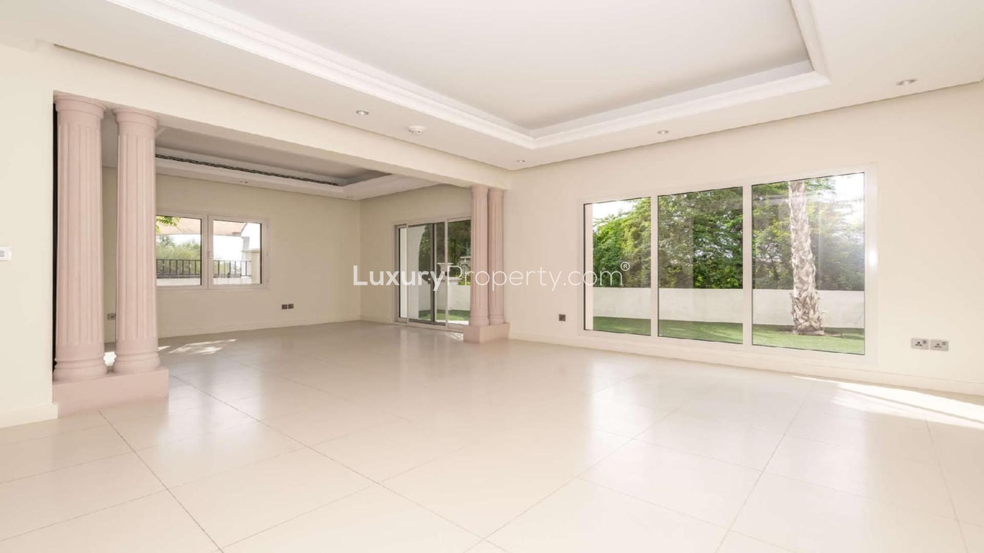 Spacious living area in Jumeirah Golf Estates townhouse, elegant design with natural light