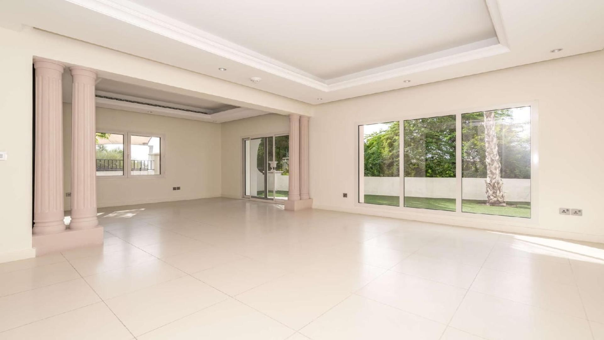 Spacious living area in Jumeirah Golf Estates townhouse, elegant design with natural light