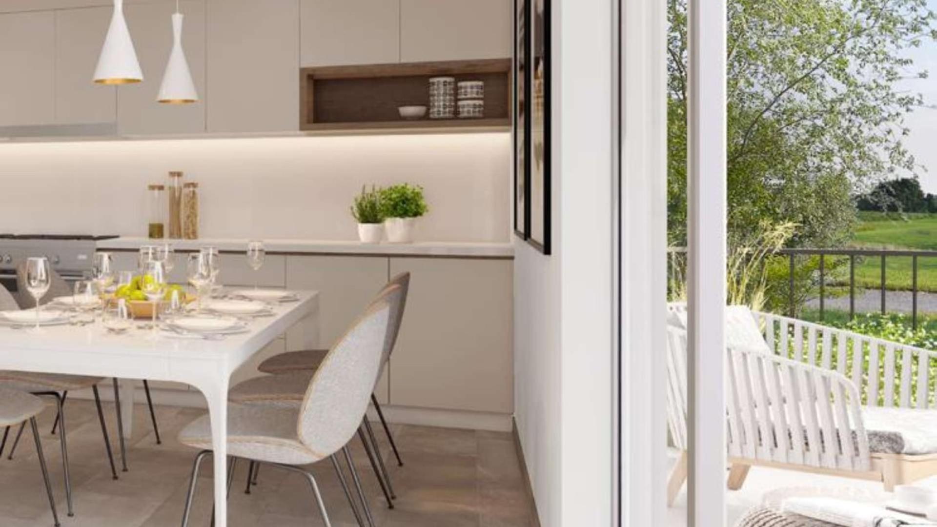 "Modern kitchen and dining area in Camelia townhouse, Arabian Ranches 2, for sale.",Modern interior detail of Camelia townhouse in Arabian Ranches 2 with stylish decor elements